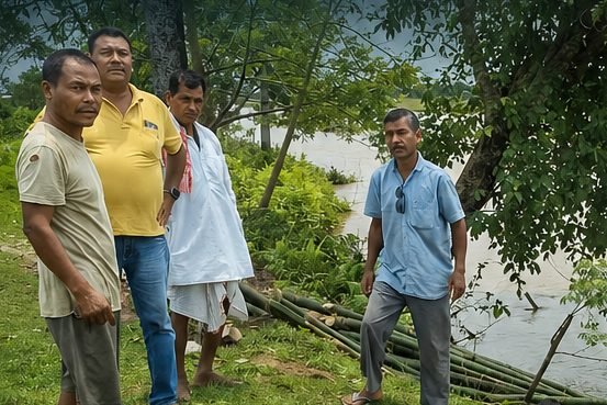 SkyShilp site team standing together beside the river