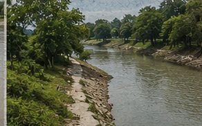 River bend with a protected bank and open country beyond